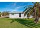 House exterior showcasing a single-story home and landscaping at 9230 Griggs Rd, Englewood, FL 34224