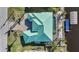Top-down view of waterfront home with teal roof at 9567 Honeymoon Dr, Port Charlotte, FL 33981