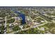 Aerial view of a waterfront community with many houses and canals at 9567 Honeymoon Dr, Port Charlotte, FL 33981
