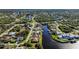 Aerial view of homes along a canal, showcasing waterfront property at 9567 Honeymoon Dr, Port Charlotte, FL 33981