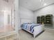 Bedroom with white wooden bed frame and built-in shelving at 9567 Honeymoon Dr, Port Charlotte, FL 33981