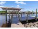 Private boat dock with lift provides convenient water access at 9567 Honeymoon Dr, Port Charlotte, FL 33981
