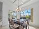 Casual dining area with table and chairs, overlooking canal at 9567 Honeymoon Dr, Port Charlotte, FL 33981