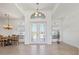 Elegant entryway with double doors and a chandelier at 9567 Honeymoon Dr, Port Charlotte, FL 33981
