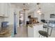 Modern kitchen with granite counters and teal cabinets at 9567 Honeymoon Dr, Port Charlotte, FL 33981