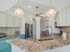 Modern kitchen with granite countertops and teal accents at 9567 Honeymoon Dr, Port Charlotte, FL 33981