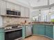 Well-equipped kitchen with stainless steel appliances at 9567 Honeymoon Dr, Port Charlotte, FL 33981