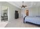 Main bedroom with king bed and access to lanai at 9567 Honeymoon Dr, Port Charlotte, FL 33981