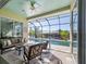 Relaxing screened pool and patio area with canal views at 9567 Honeymoon Dr, Port Charlotte, FL 33981