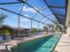 Long, refreshing pool with screened enclosure and canal view at 9567 Honeymoon Dr, Port Charlotte, FL 33981