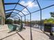 Relaxing screened pool and patio with canal views and grill at 9567 Honeymoon Dr, Port Charlotte, FL 33981