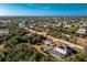 An aerial view of a home with a pool and a large backyard at 9661 Nastrand Cir, Port Charlotte, FL 33981