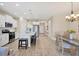 Modern kitchen with island, stainless steel appliances, and white cabinets at 11201 Mcdermott Ct, Englewood, FL 34223