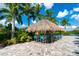 Enjoy drinks under the tiki hut by the pool at 11201 Mcdermott Ct, Englewood, FL 34223