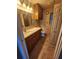 Bathroom with vanity sink, toilet, and tiled floor at 1329 Sheehan Blvd, Port Charlotte, FL 33952