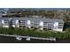 Aerial view of a waterfront condo building with private boat docks at 1401 S Mccall Rd # 306B, Englewood, FL 34223