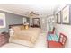 Main bedroom with king-size bed and access to balcony at 1401 S Mccall Rd # 306B, Englewood, FL 34223