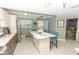 Open concept kitchen with breakfast bar and access to balcony at 1401 S Mccall Rd # 306B, Englewood, FL 34223