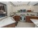 Modern kitchen featuring updated cabinets and granite countertops at 1401 S Mccall Rd # 306B, Englewood, FL 34223