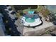 Kidney-shaped community pool with a hot tub and shaded seating area at 1401 S Mccall Rd # 306B, Englewood, FL 34223