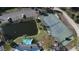 Community tennis court and pickleball court with pond views at 1401 S Mccall Rd # 306B, Englewood, FL 34223