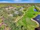 Aerial view showcasing home and surrounding golf course at 14049 Willow Glen Ct # 242, Port Charlotte, FL 33953