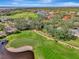 Aerial view of the community, showcasing the golf course and homes at 14049 Willow Glen Ct # 242, Port Charlotte, FL 33953