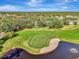 Aerial view highlighting home's location near golf course at 14049 Willow Glen Ct # 242, Port Charlotte, FL 33953