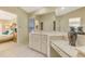 Elegant bathroom with double vanity and view of bedroom at 14049 Willow Glen Ct # 242, Port Charlotte, FL 33953