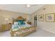Spacious Primary bedroom with king-size bed and ensuite bathroom access at 14049 Willow Glen Ct # 242, Port Charlotte, FL 33953