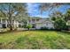 Two-story house with a front yard and landscaping at 14049 Willow Glen Ct # 242, Port Charlotte, FL 33953