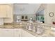 Kitchen with granite countertops, double sink, and modern appliances at 14049 Willow Glen Ct # 242, Port Charlotte, FL 33953