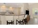 Modern kitchen with white cabinets and granite counters at 14049 Willow Glen Ct # 242, Port Charlotte, FL 33953