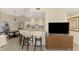 Updated kitchen featuring breakfast bar and view to living room at 14049 Willow Glen Ct # 242, Port Charlotte, FL 33953