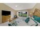 Large bedroom with king bed, golf course view, and ample closet space at 14049 Willow Glen Ct # 242, Port Charlotte, FL 33953