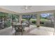 Relaxing screened porch with patio furniture and golf course views at 14049 Willow Glen Ct # 242, Port Charlotte, FL 33953