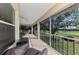 Covered porch with seating area, overlooking the golf course at 14049 Willow Glen Ct # 242, Port Charlotte, FL 33953