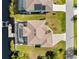 An aerial view of the home showcasing its layout, pool, canal access and well-maintained yard at 15104 Aldama Cir, Port Charlotte, FL 33981