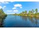 Enjoy the serene waterfront views from this peaceful canal at 15104 Aldama Cir, Port Charlotte, FL 33981