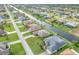 Aerial view of waterfront homes with beautiful landscaping and private docks along a tranquil canal at 171 Medalist Rd, Rotonda West, FL 33947