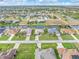 Aerial view of waterfront properties offering scenic canal access and lush landscaping in a desirable neighborhood at 171 Medalist Rd, Rotonda West, FL 33947