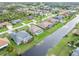 An aerial view of waterfront homes with pools and lush landscaping at 171 Medalist Rd, Rotonda West, FL 33947
