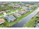 An aerial view of waterfront homes with pools and lush landscaping at 171 Medalist Rd, Rotonda West, FL 33947