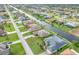 Aerial view of waterfront homes with beautiful landscaping and private docks along a tranquil canal at 171 Medalist Rd, Rotonda West, FL 33947