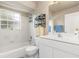 Inviting bathroom featuring a combination tub and shower, a vanity, and a well-lit mirror at 171 Medalist Rd, Rotonda West, FL 33947