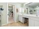 Bathroom featuring double sinks, vanity area, and an open doorway to other rooms at 171 Medalist Rd, Rotonda West, FL 33947