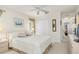 Inviting bedroom offering a queen-size bed, neutral decor, and storage space at 171 Medalist Rd, Rotonda West, FL 33947