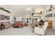 Bright open living area with high ceilings, open floor plan, and views of the kitchen at 171 Medalist Rd, Rotonda West, FL 33947