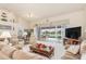 Spacious living room with comfortable seating and pool views at 171 Medalist Rd, Rotonda West, FL 33947