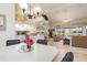 Open-concept living space showcasing the kitchen, dining area, and comfortable lounge area with a pool view at 171 Medalist Rd, Rotonda West, FL 33947